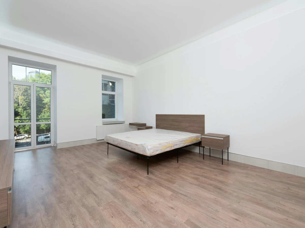 Minimalist white bedroom painted by Haywards Heath Decorators in Mid Sussex