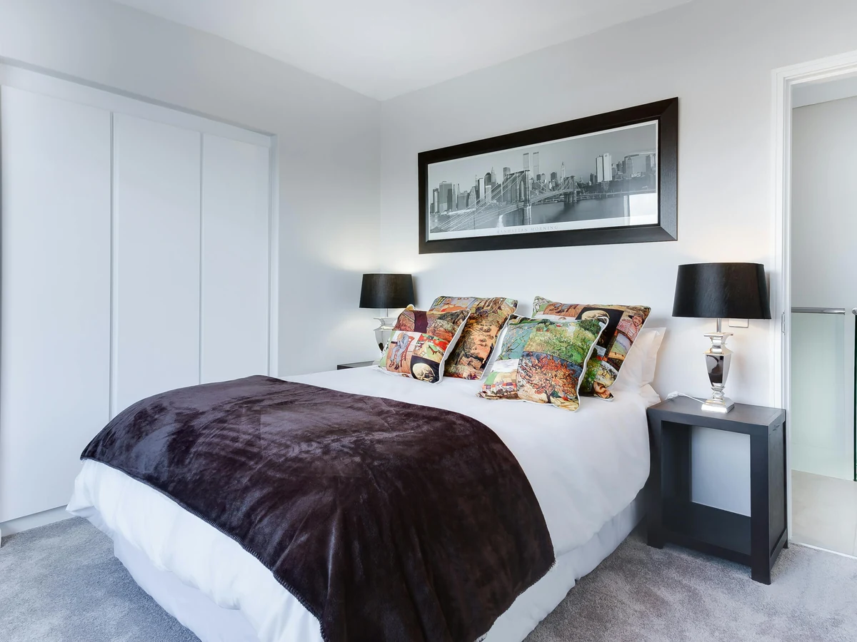 Modern white bedroom painted by Haywards Heath Decorators with clean, consistent finish