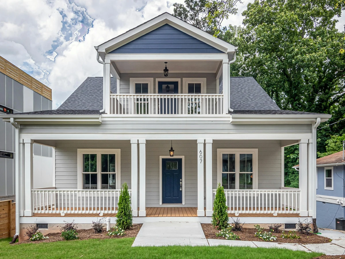 Exterior painting white two-storey house in Haywards Heath