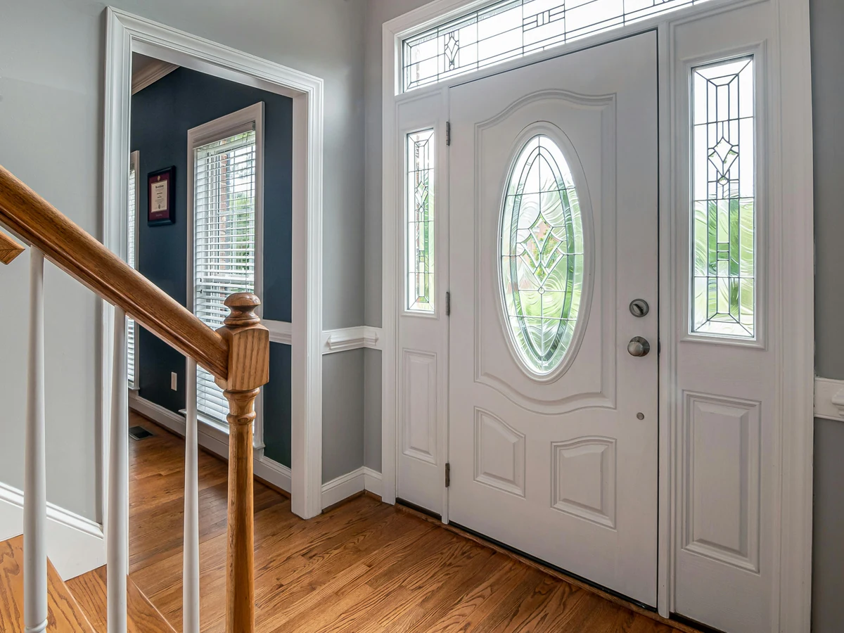 White painted entrance hallway behind front door in Haywards Heath