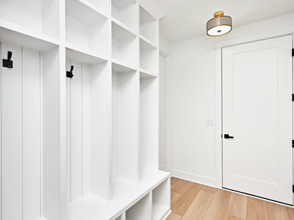 Hallway painting white mudroom and coat area in Haywards Heath by Haywards Heath Decorators