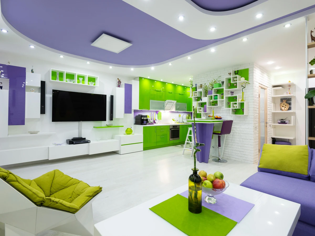 Feature wall painting vibrant green and purple living room in Haywards Heath