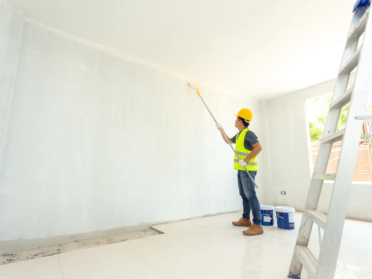 Wall painter in hi-vis rolling walls in Haywards Heath by Haywards Heath Decorators